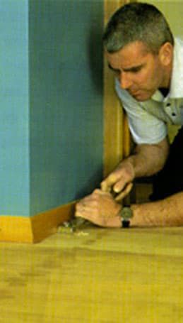 John O'Riordan - owner of Simply the Best Floor Sanding doing the work